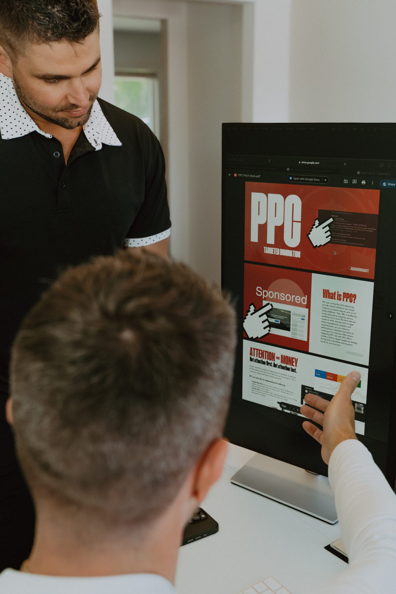 JUGGERNAUT Marketing team discussing a campaign on screen
